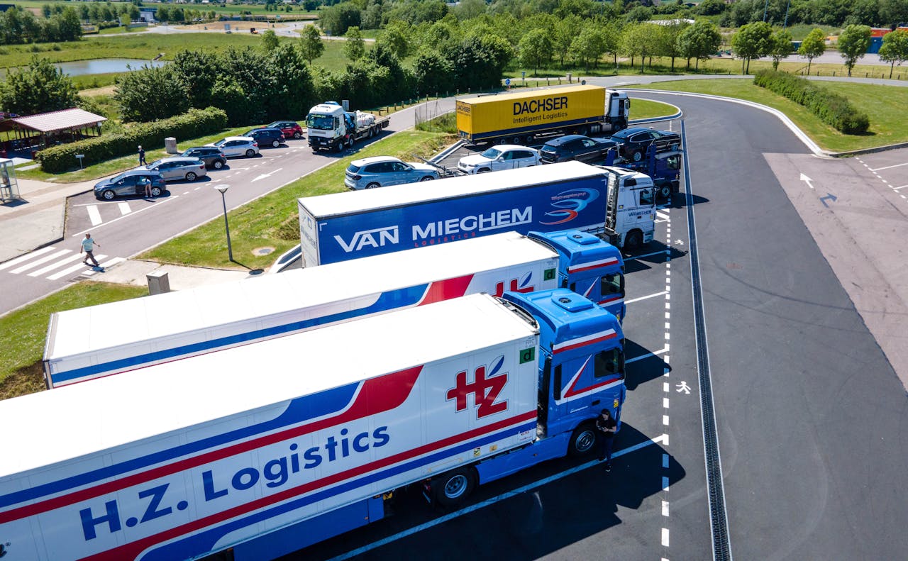 Aerial image showcasing logistics trucks parked in a rest area.